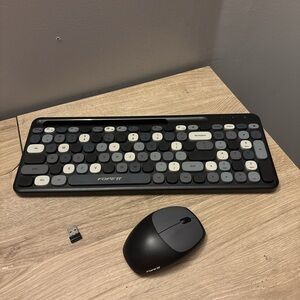 Black and grey keyboard and mouse set